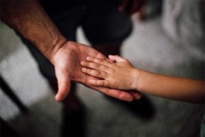 Montana-Alimony-fathers-hand-with-childs-hand